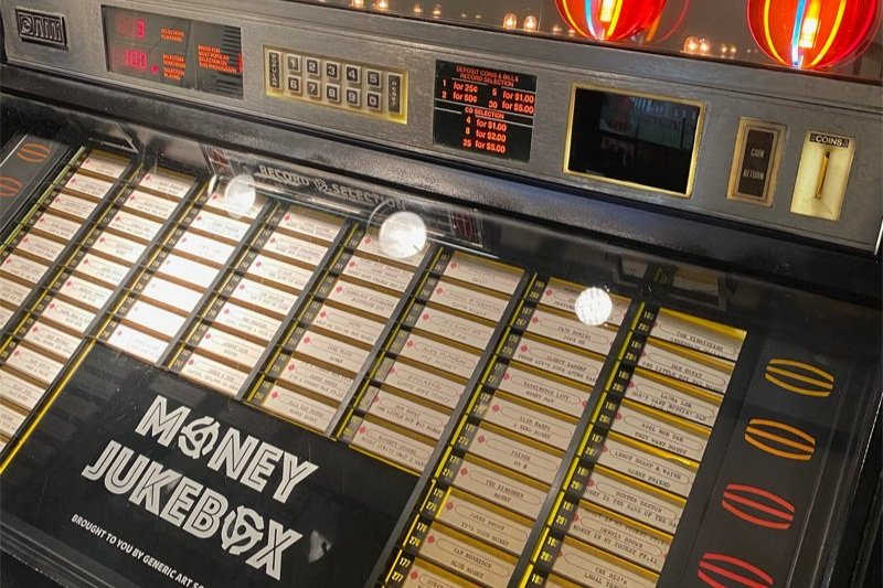 “The Money Jukebox.” A fully functional Jukebox loaded with 7” disks featuring Money-themed songs.