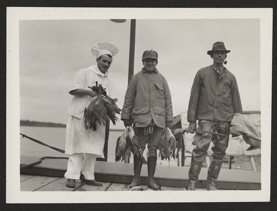 Left to Right: Chef Gus Caradjas, Harvey S. Firestone Jr. of Firestone Tire and Rubber, and guide Charley Johnson at the state-owned Conservation Club near the mouth of the Mississippi, 1936. Courtesy of LSU Special Collections, Seymour Weiss Papers.