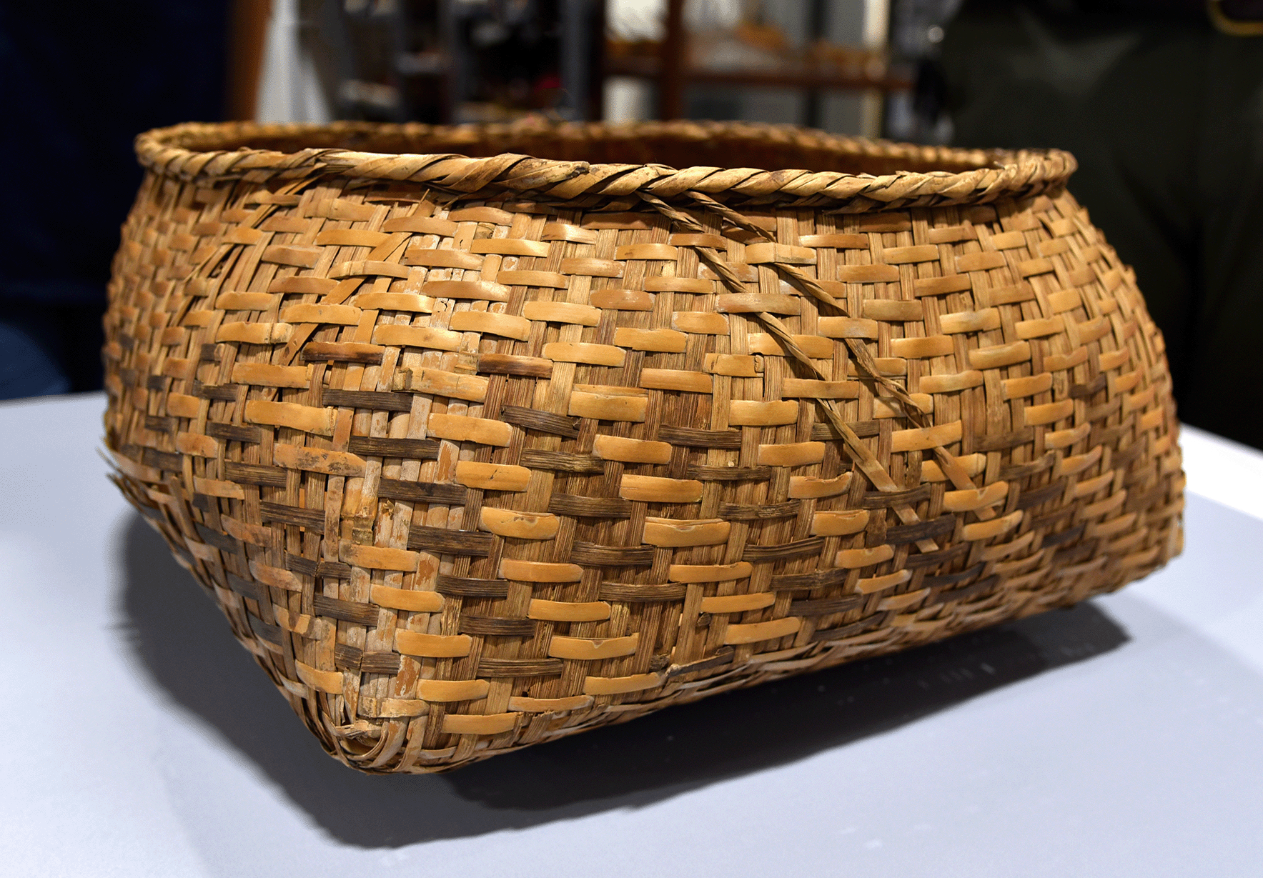 Choctaw Rite of Passage Basket: A Choctaw rite of passage basket from the Cane River Creole National Historical Park collection. This intricately woven basket, used in traditional ceremonial practices, reflects the cultural heritage and craftsmanship of the Choctaw people, who played a vital role in the history of the Cane River region.
