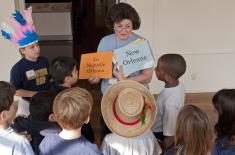 Teacher working with students at the museums.